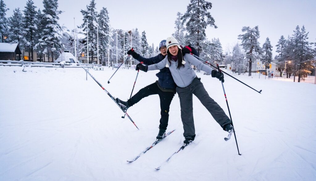 two people wearing cross country skiing gears on the snow